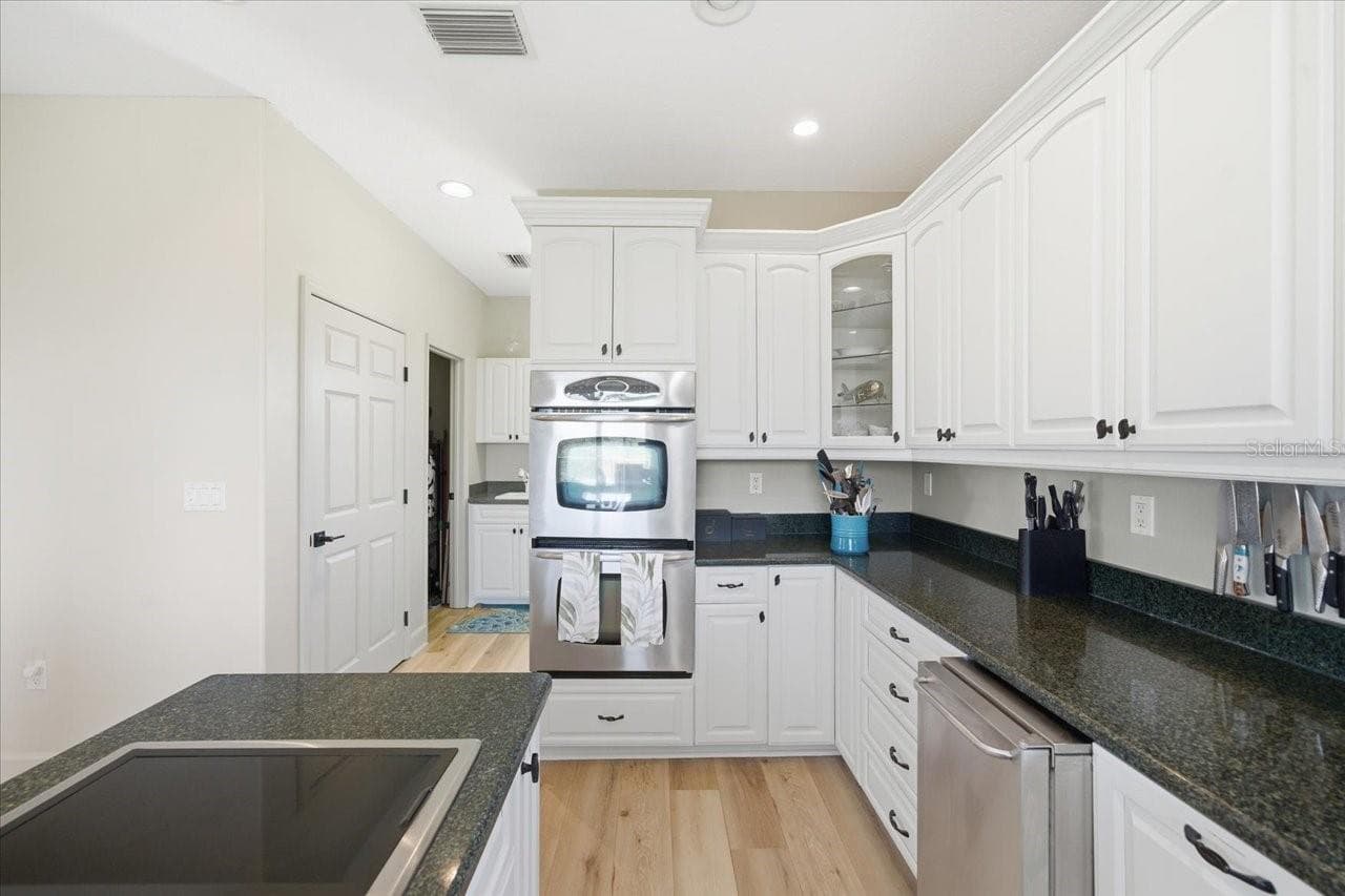 View into adjacent laundry room and large closet pantry - 1130 S FLORIDA AVE, TARPON SPRINGS