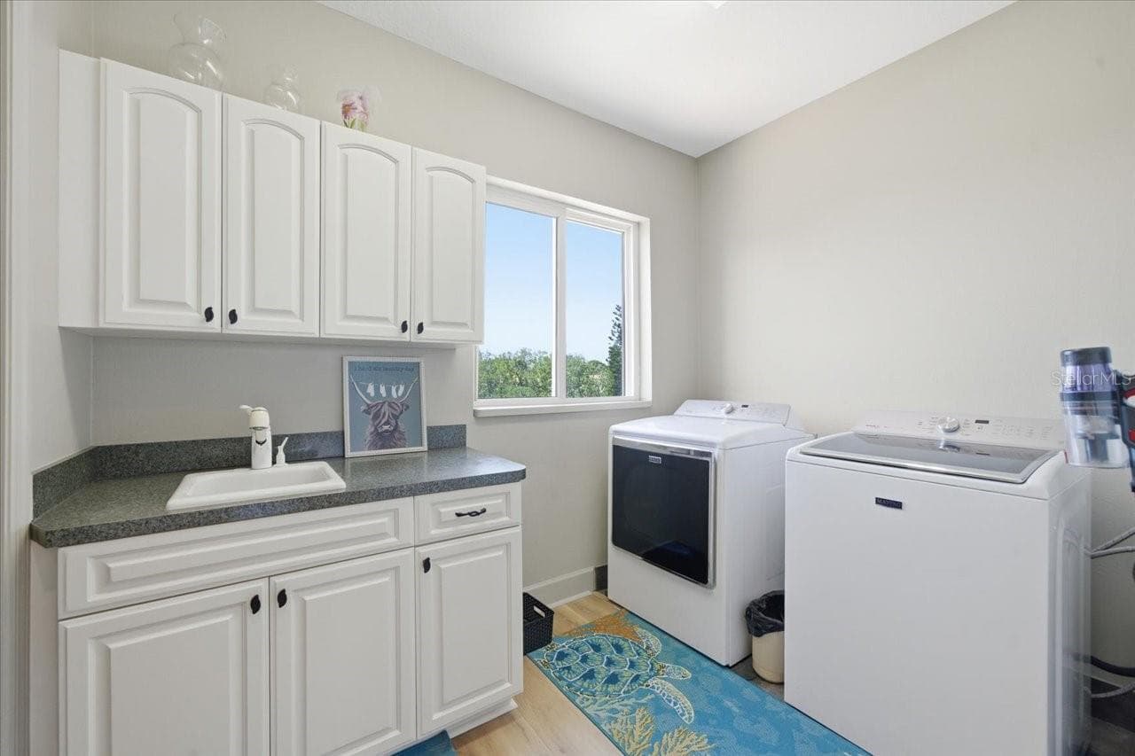Laundry room with large pantry to left of picture off kitchen - 1130 S FLORIDA AVE, TARPON SPRINGS