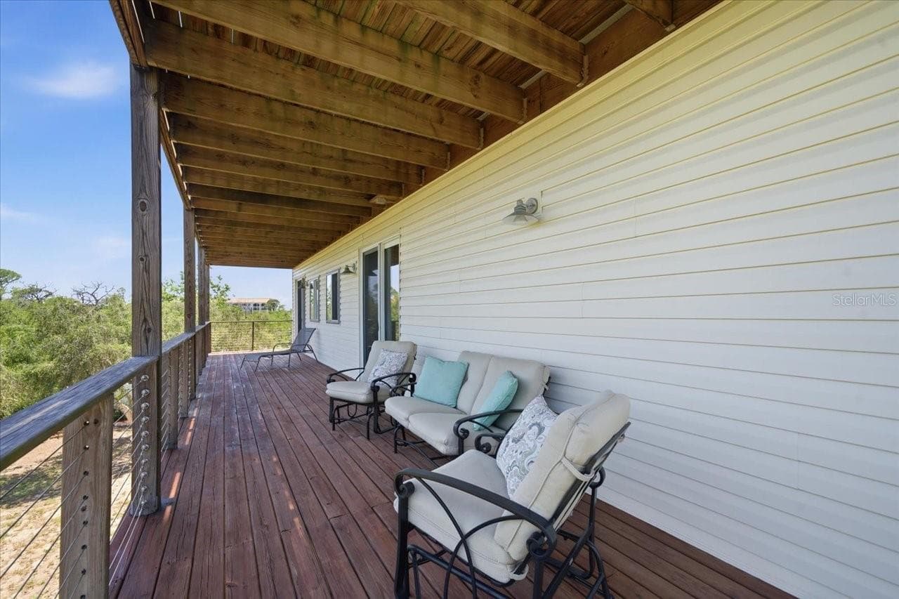 Covered balcony/deck from 2nd level-Primary and 3rd bedroom access - 1130 S FLORIDA AVE, TARPON SPRINGS