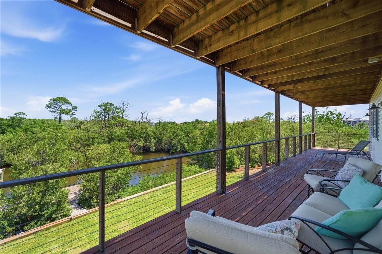 Covered balcony/deck from 2nd level-Primary and 3rd bedroom access - 1130 S FLORIDA AVE, TARPON SPRINGS