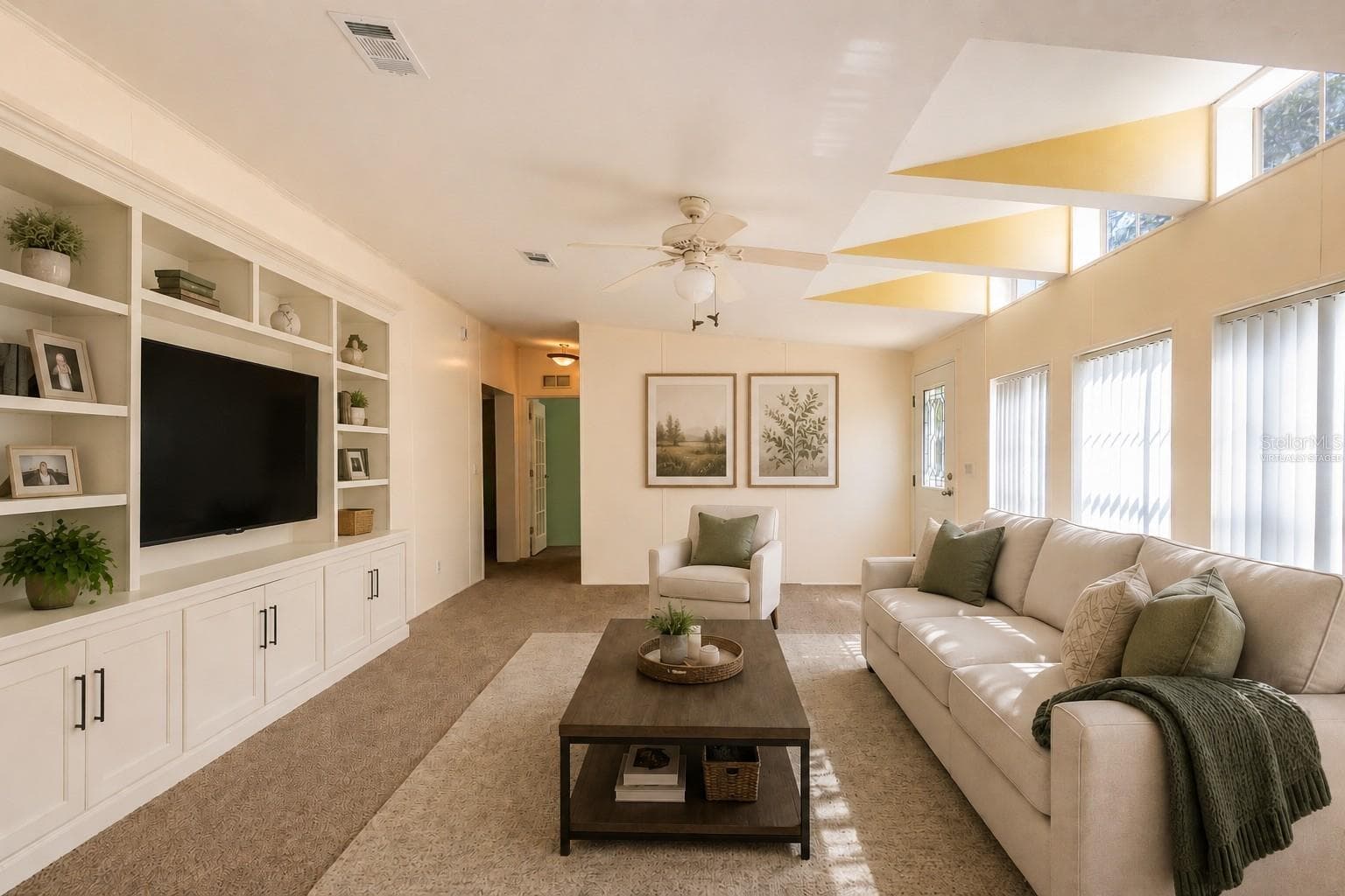 Virtually staged living room. - 14221 HURRICANE DR, WEEKI WACHEE
