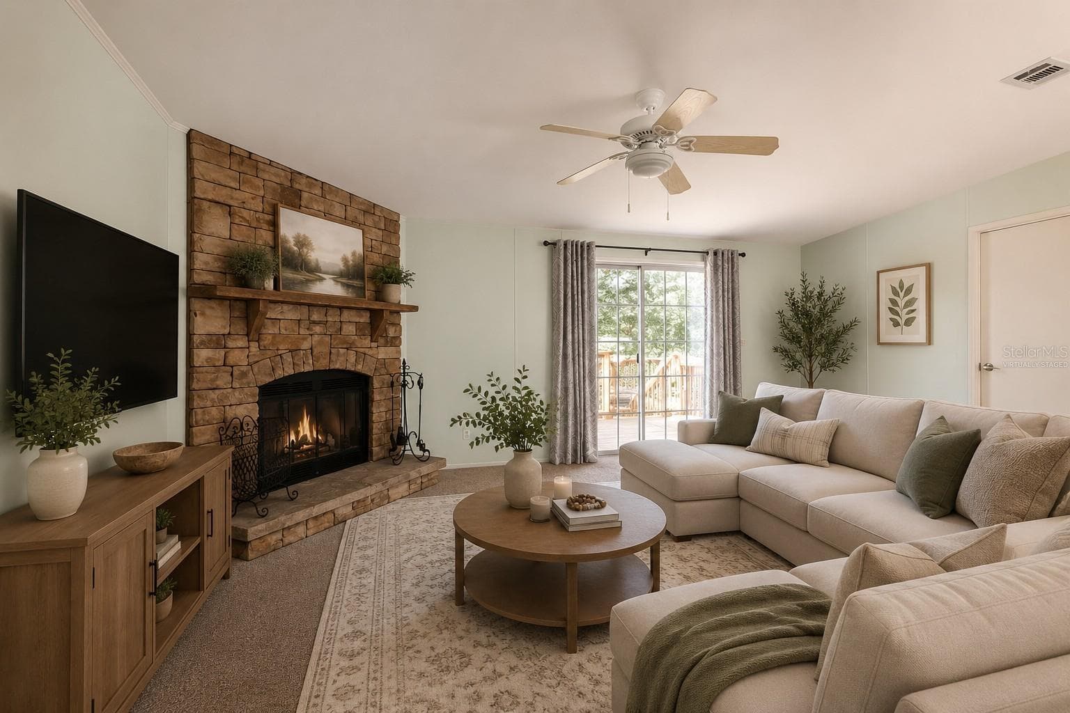 Virtually staged great room with decor. - 14221 HURRICANE DR, WEEKI WACHEE