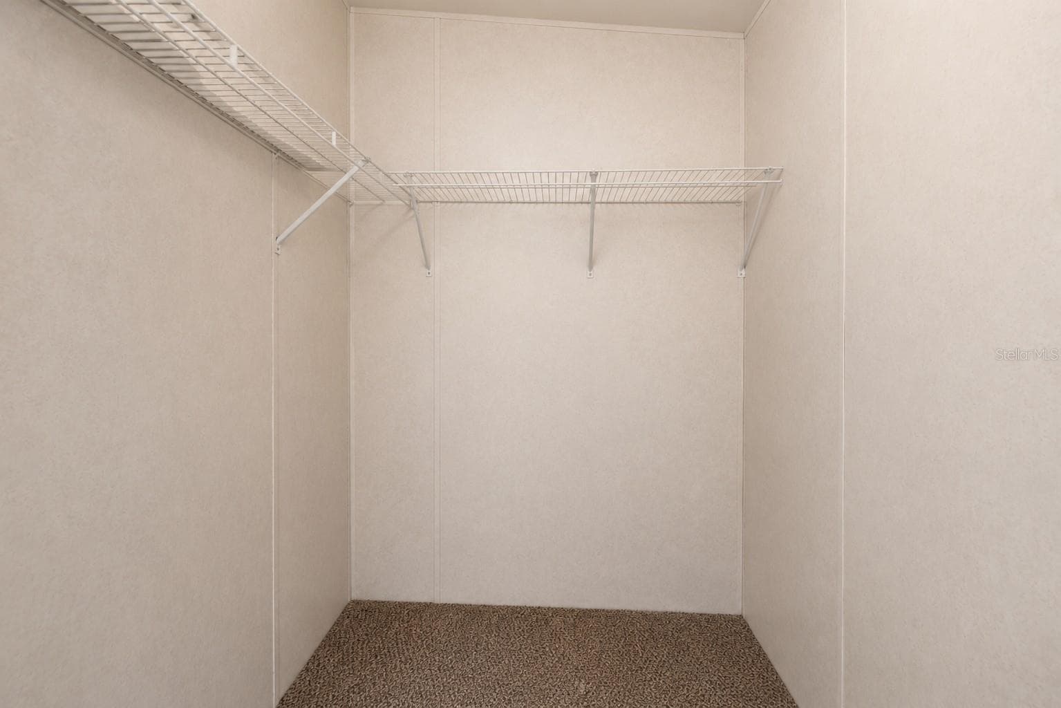 Bedroom 2 walk-in closet. - 14221 HURRICANE DR, WEEKI WACHEE