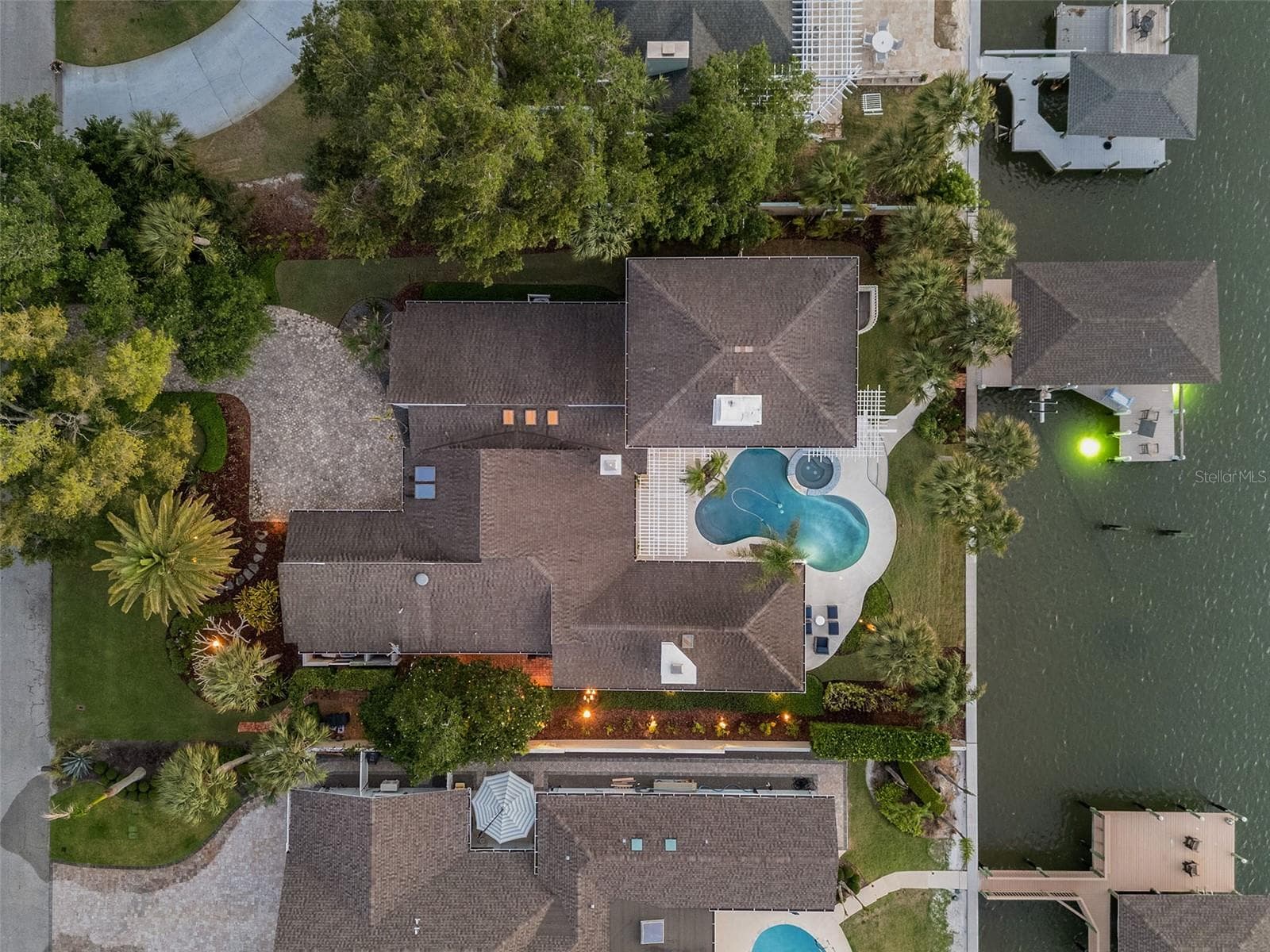 Seawall New in 2026. Private Dock w/ 20,000 covered boat lift, jet ski lift and 10x18 deck over the water - 1215 COMMODORE DR, NEW SMYRNA BEACH
