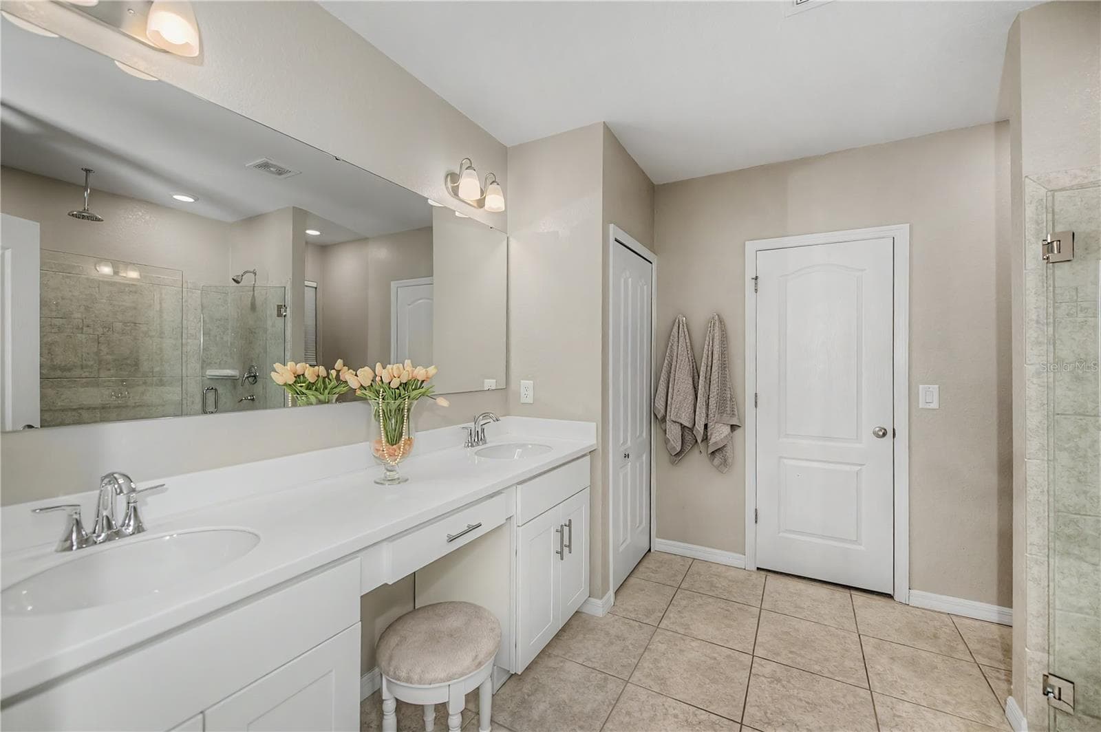 Spa Inspired Primary Bath with Dual Vanities and Makeup Area. - 640 ENCARNACION ST, PUNTA GORDA