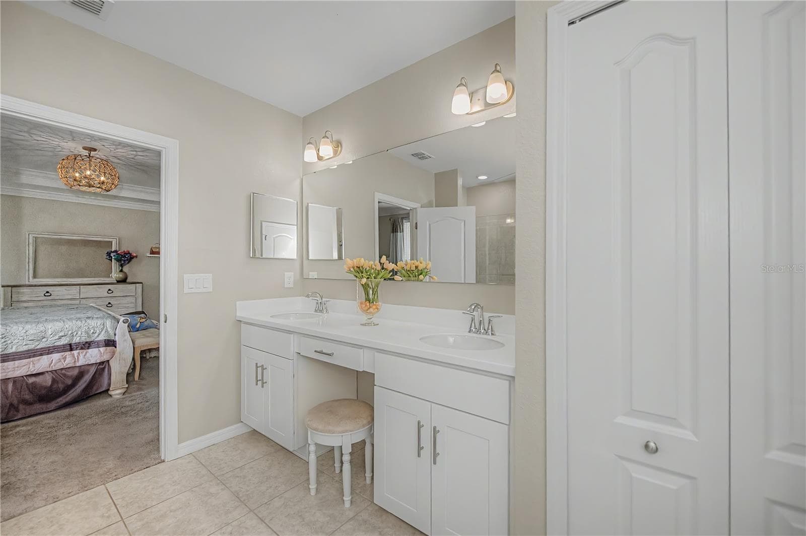 Spa Inspired Primary Bath with Dual Vanities and Makeup Area. - 640 ENCARNACION ST, PUNTA GORDA