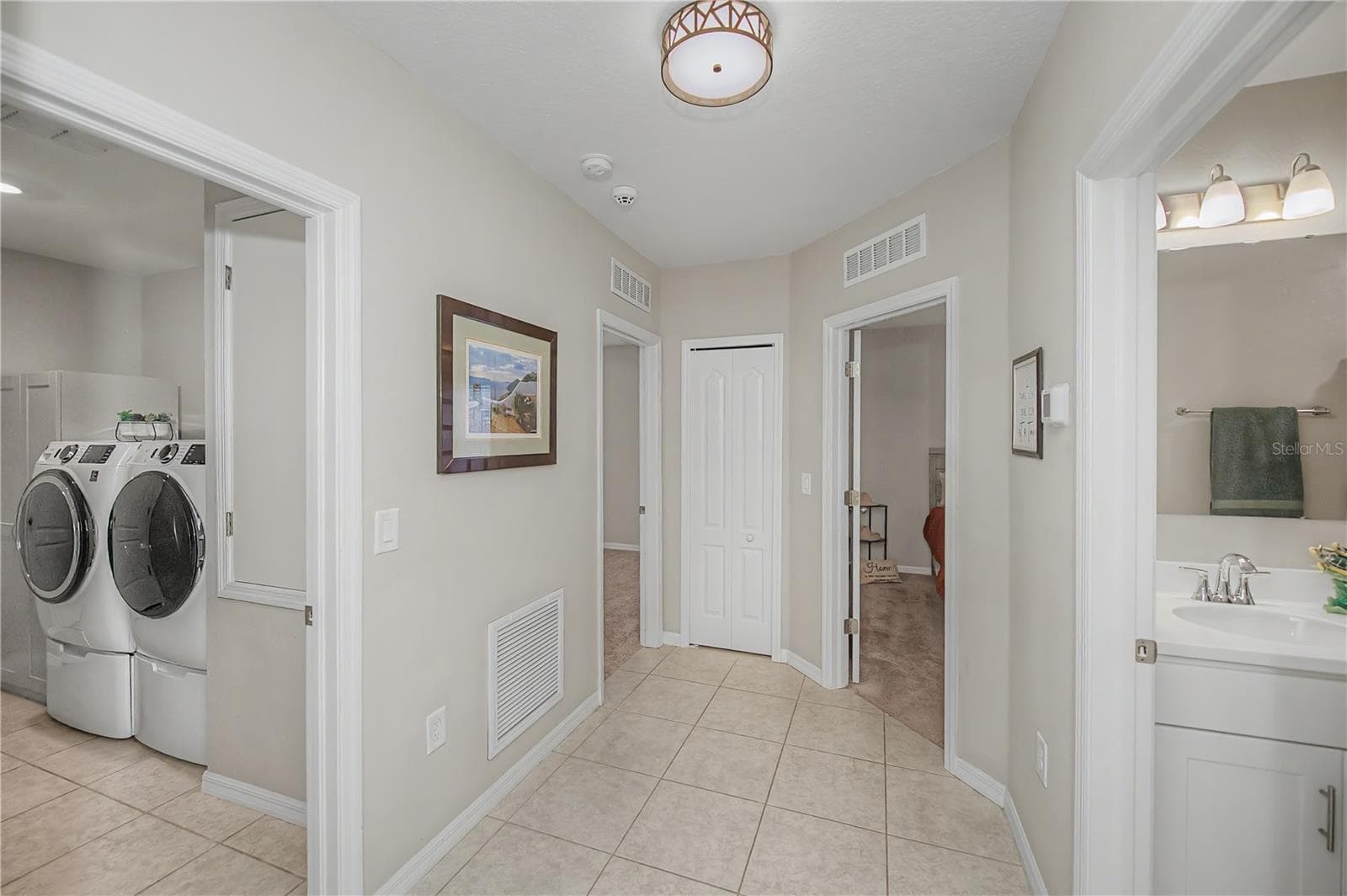 Guest Wing Hallway with Laundry Access. - 640 ENCARNACION ST, PUNTA GORDA