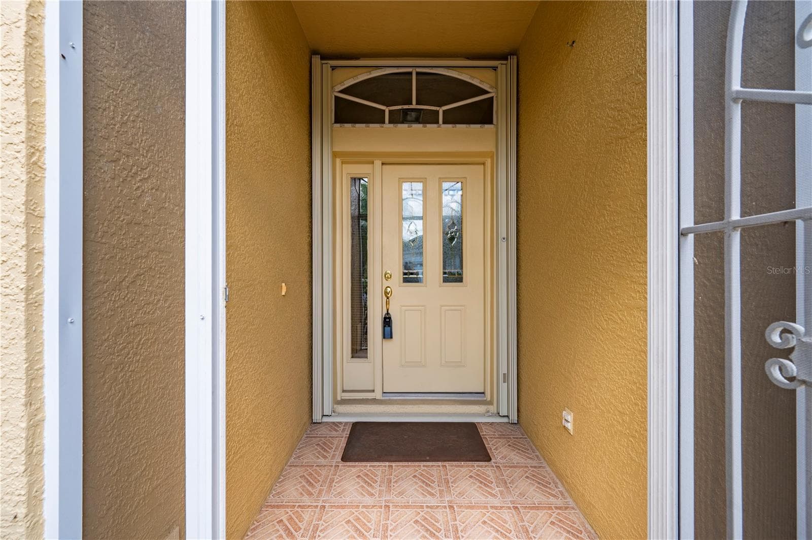 Front door has beveled glass, accordian storm shutters - 1637 PALACE CT, PORT CHARLOTTE