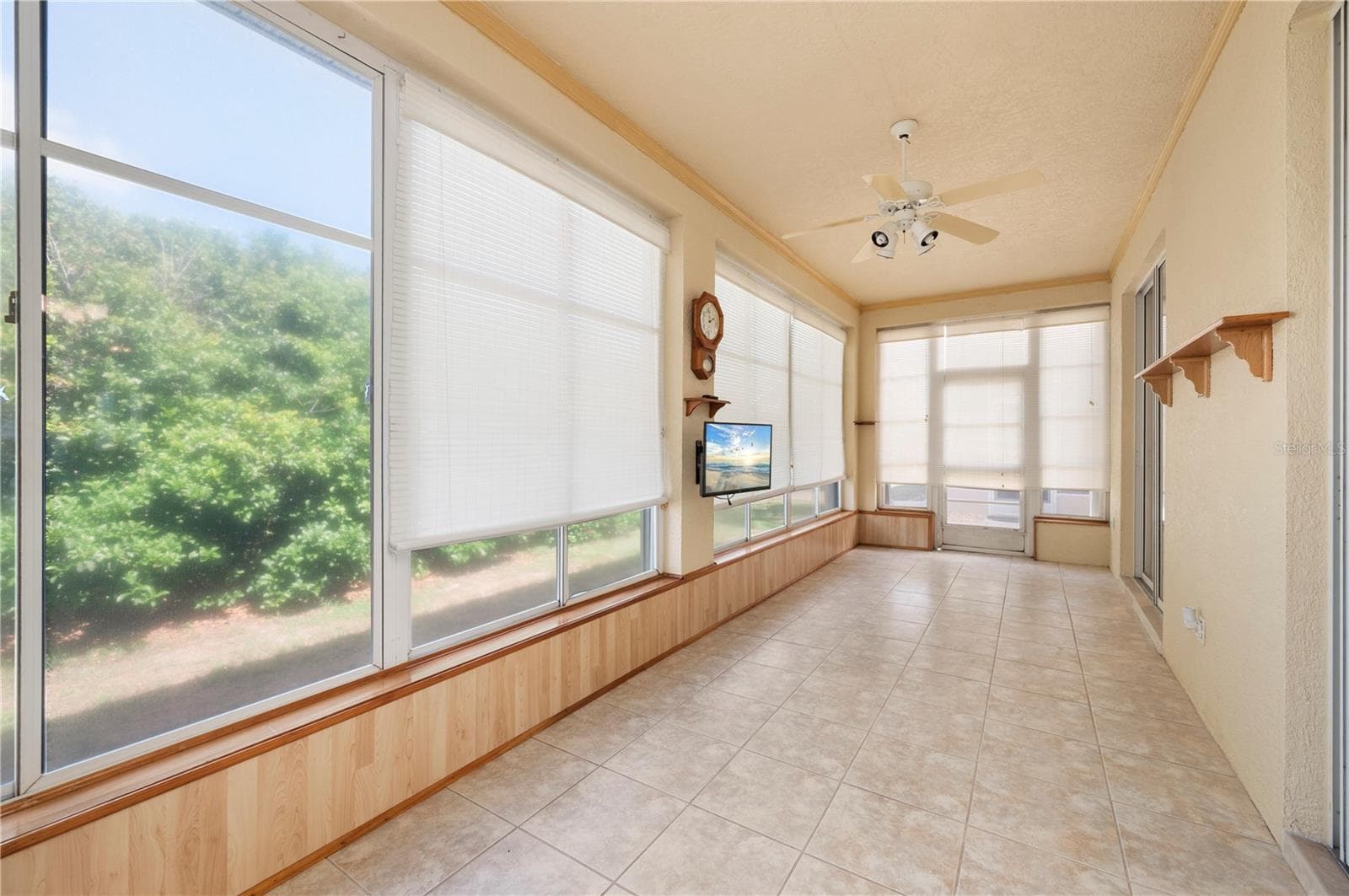 The tiled lanai has ceiling fans, blinds - 1637 PALACE CT, PORT CHARLOTTE