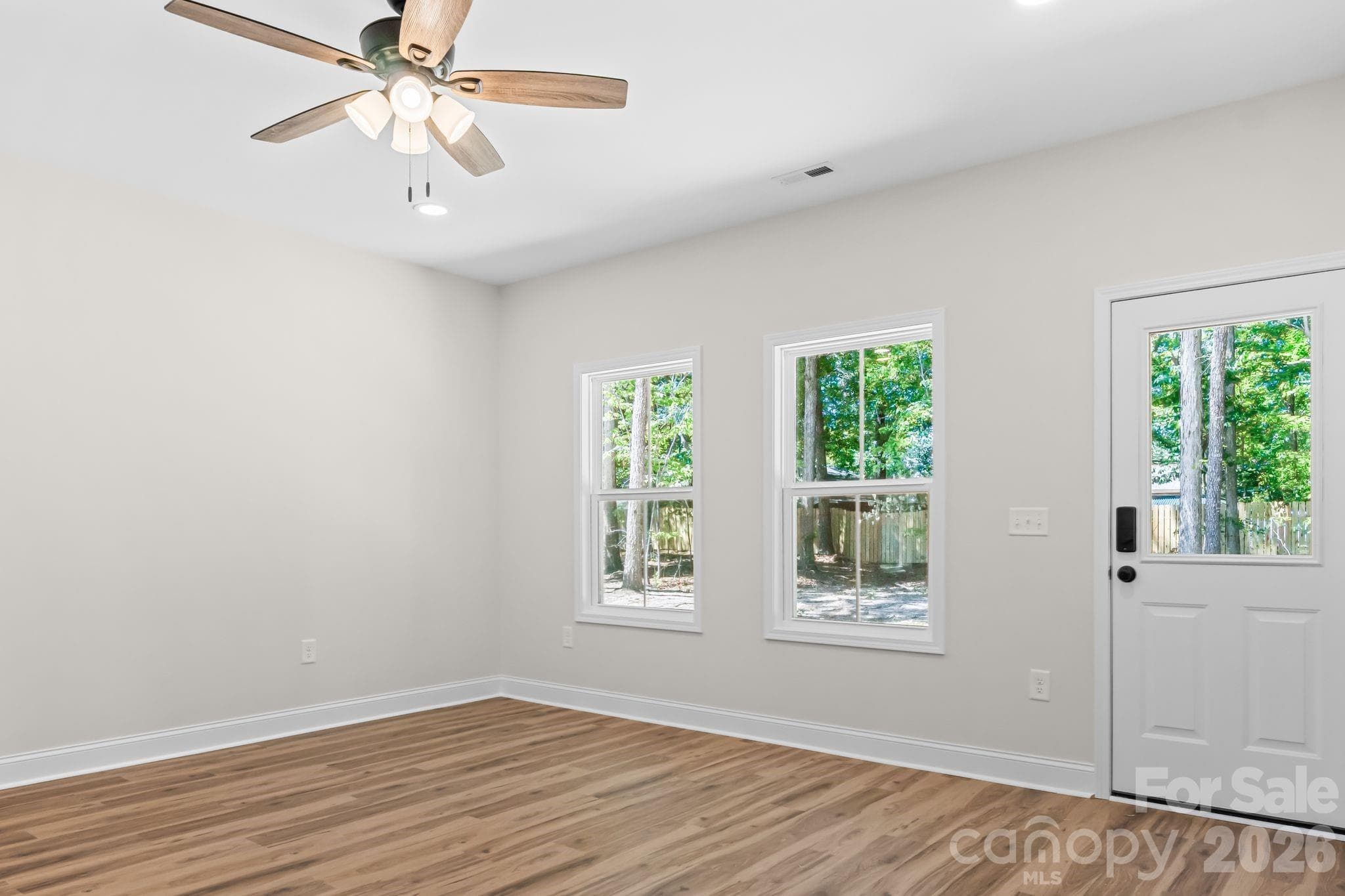 Living room with ceiling fan - 2123 Woodhurst Lane, Albemarle