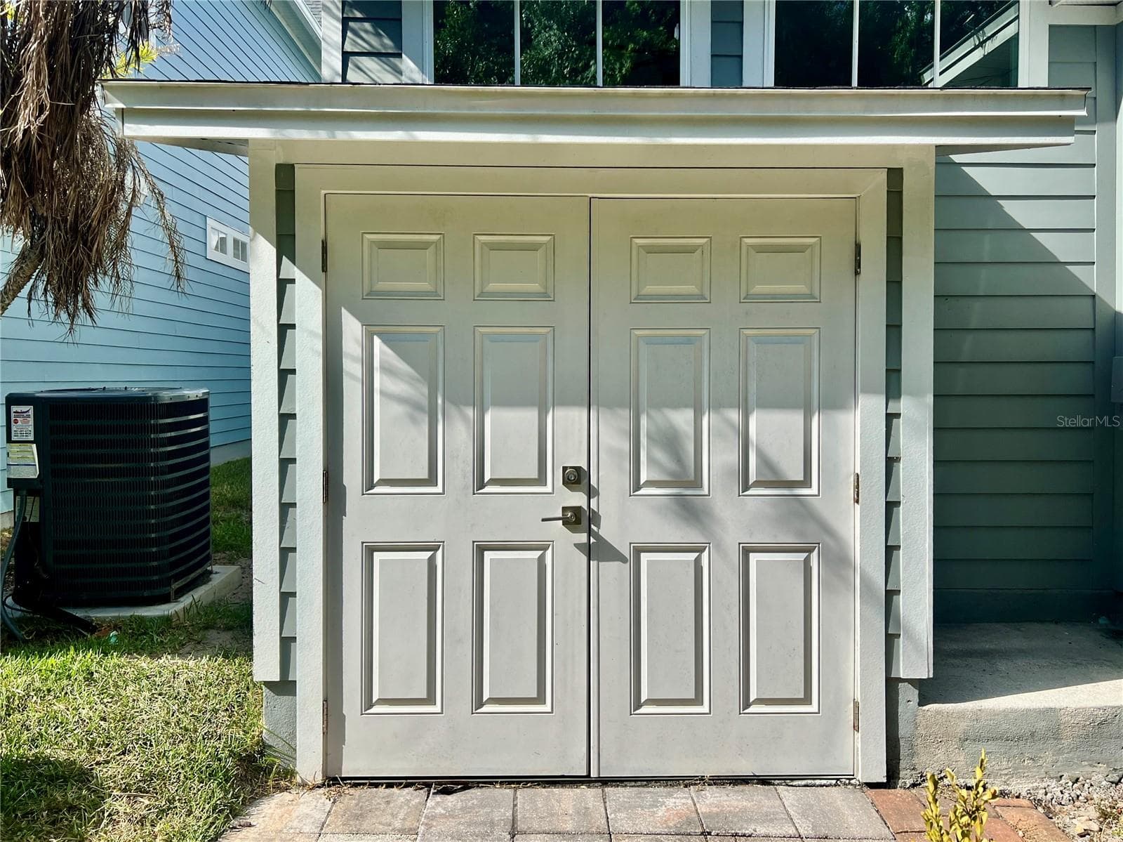 Attached storage closet - added on by seller - 839 LAKE EVALYN DR, CELEBRATION