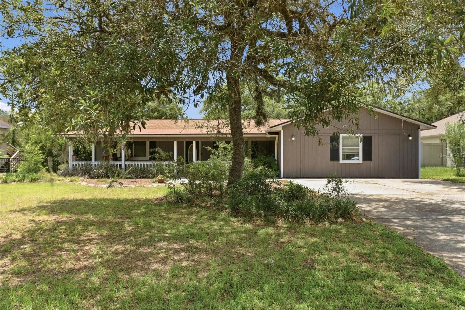 Mature oak trees and fruit trees on the property - 8720 N TROJAN DR, CITRUS SPRINGS