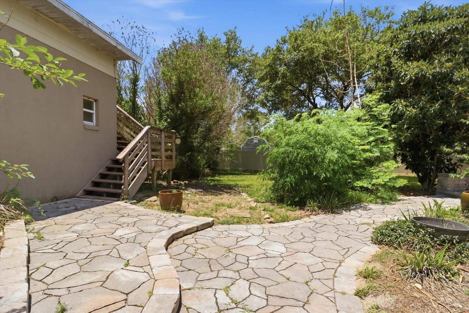 pavered walkway will lead you up the stairs to the MIL suite - 8720 N TROJAN DR, CITRUS SPRINGS
