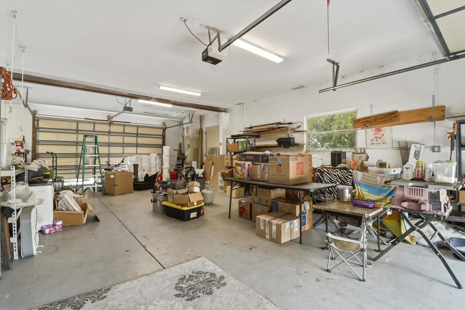 plenty of storage in garage - 8720 N TROJAN DR, CITRUS SPRINGS