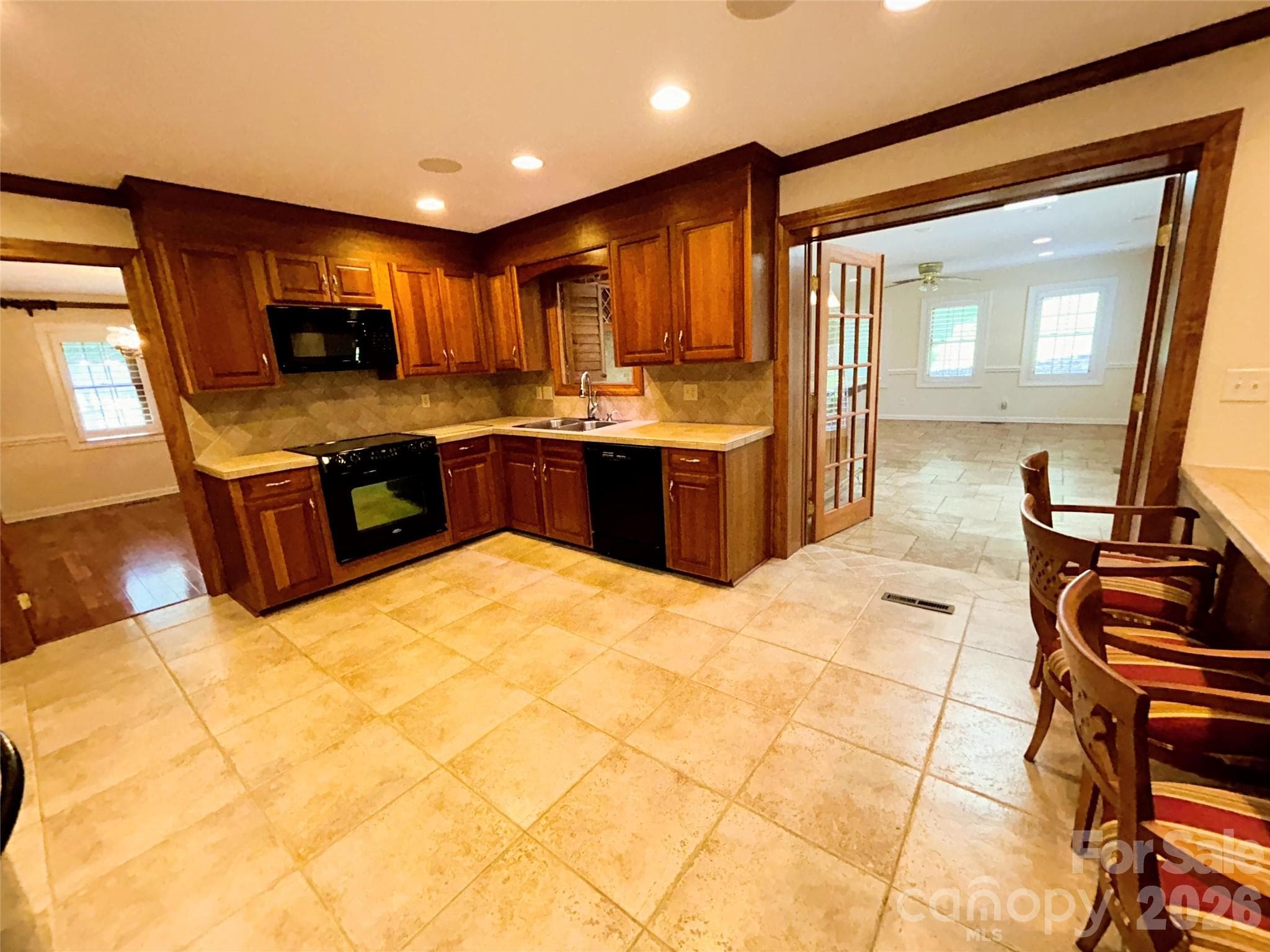 Kitchen with view of adjacent Sunroom - 900 Courtney Court SE, Concord