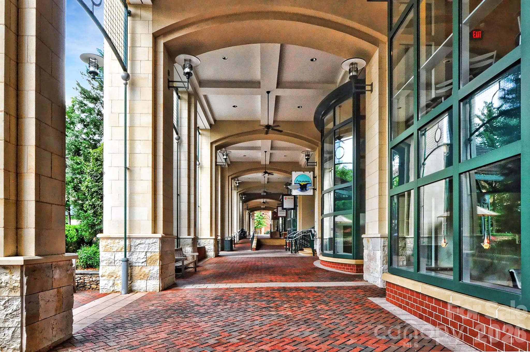 Shops and restaurants at the base of the building along the park. - 435 S Tryon Street, Charlotte