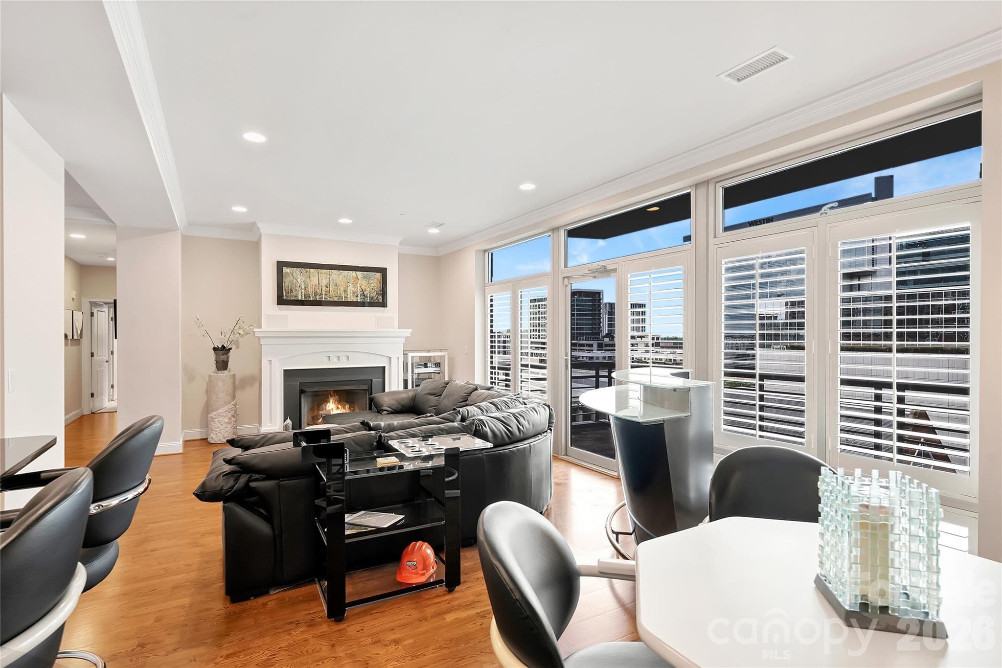 Open living and dining spaces filled with natural light and views of The Green. - 435 S Tryon Street, Charlotte