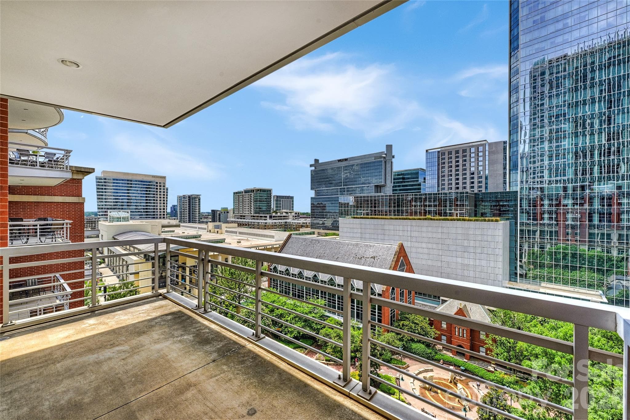 A true covered terrace overlooking The Green — outdoor living in the heart of Uptown. - 435 S Tryon Street, Charlotte