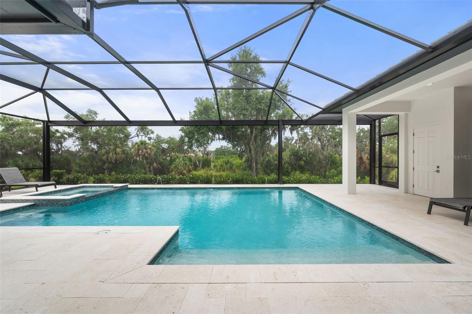 One of the most extraordinary features of the property is the spectacular screened outdoor living space designed to fully embrace Florida’s year-round indoor-outdoor lifestyle. - 11721 RIVE ISLE RUN, PARRISH