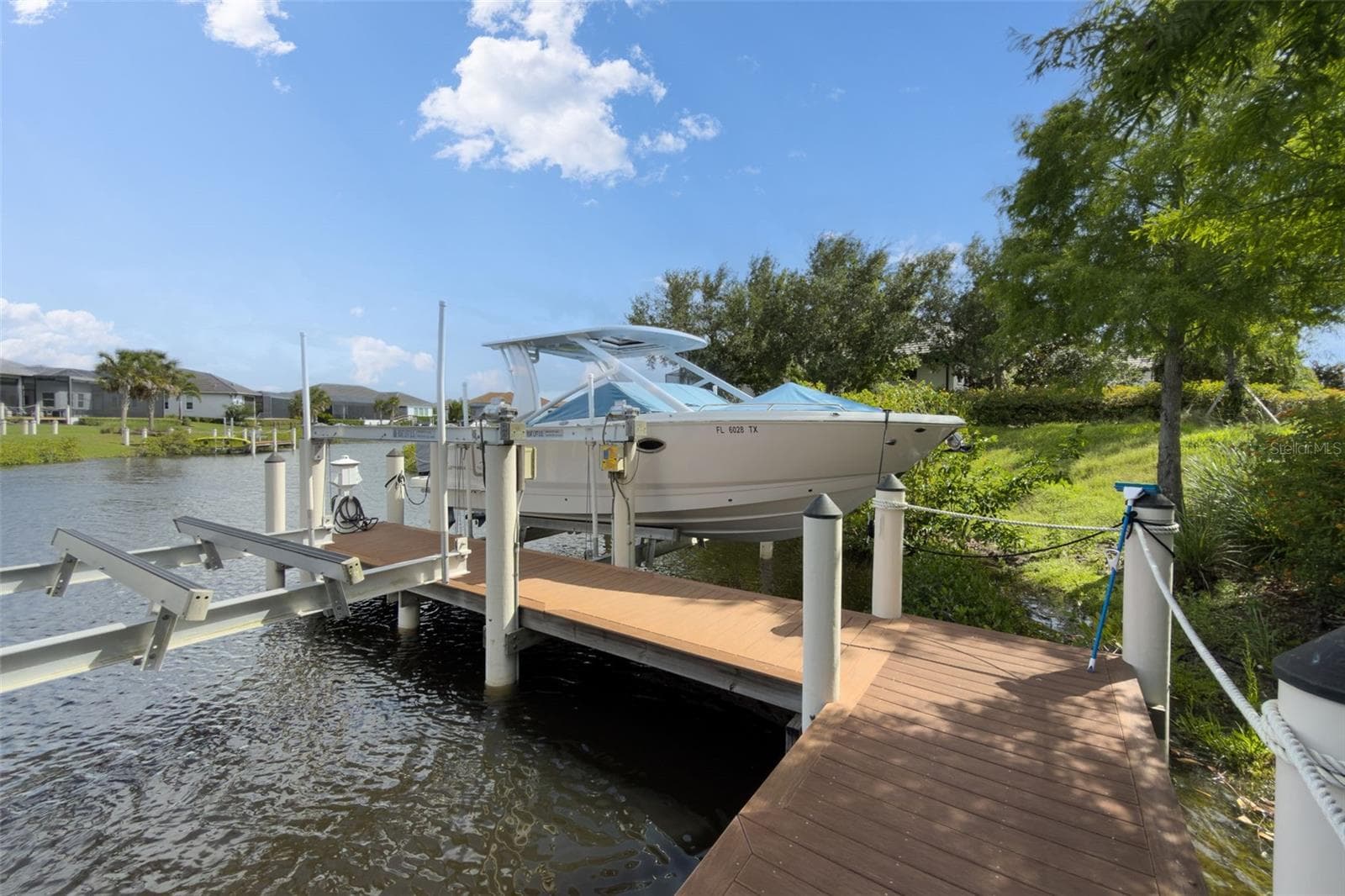 The home comes with a deeded boat lift where you have direct access to the Manatee River and the Gulf! - 11721 RIVE ISLE RUN, PARRISH