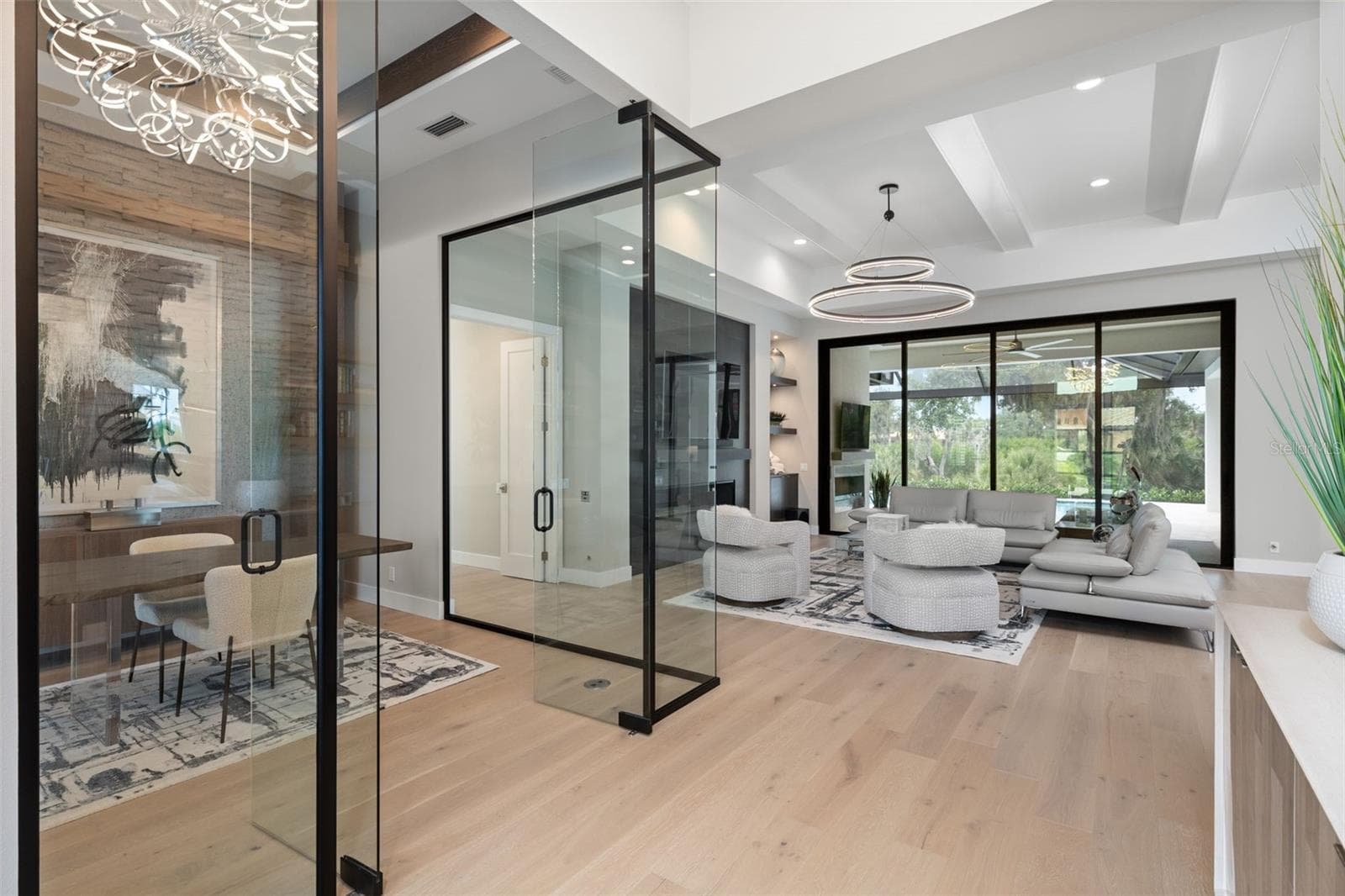 Custom lighting, designer finishes, elegant drapery, plantation shutters and high-end built-in features, show that every detail of this home has been carefully considered. - 11721 RIVE ISLE RUN, PARRISH