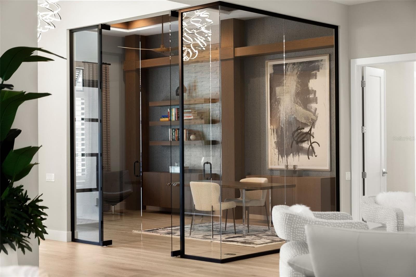 Designed with today's lifestyle in mind, the den/office is enclosed with glass walls. - 11721 RIVE ISLE RUN, PARRISH