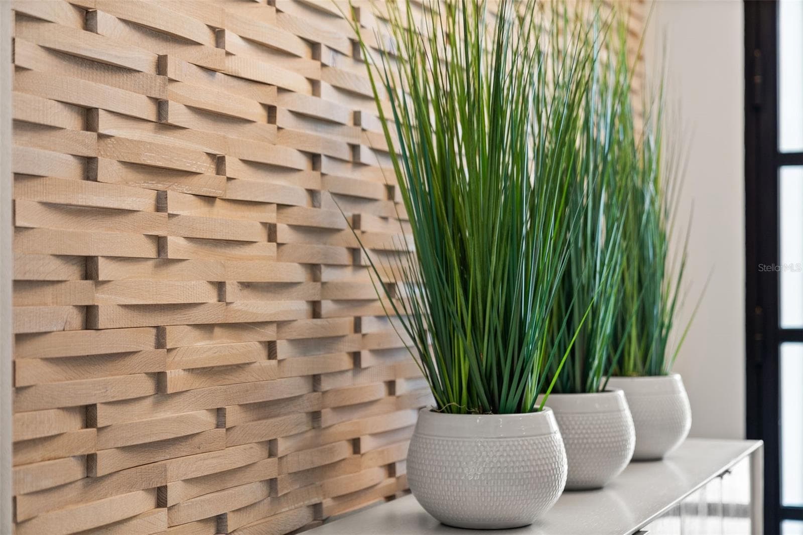 The foyer has a custom Duchateau accent wall. - 11721 RIVE ISLE RUN, PARRISH