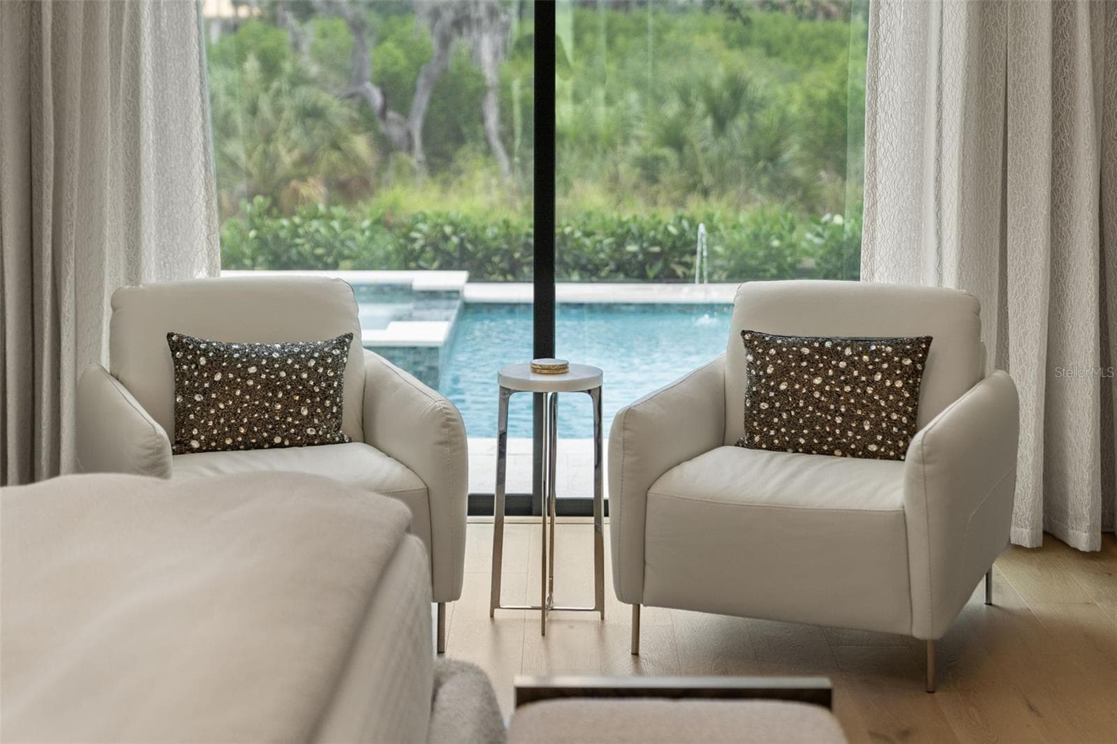 The spacious primary suite has plenty of room for relaxation after a day on the boat or at the pool! - 11721 RIVE ISLE RUN, PARRISH