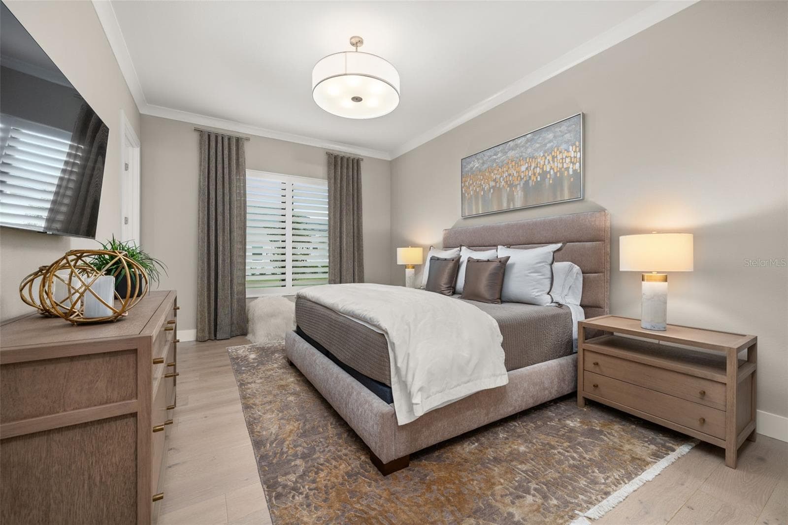 The other guest room has a walk-in closet, crown molding custom lighting, drapery and en-suite bathroom. - 11721 RIVE ISLE RUN, PARRISH