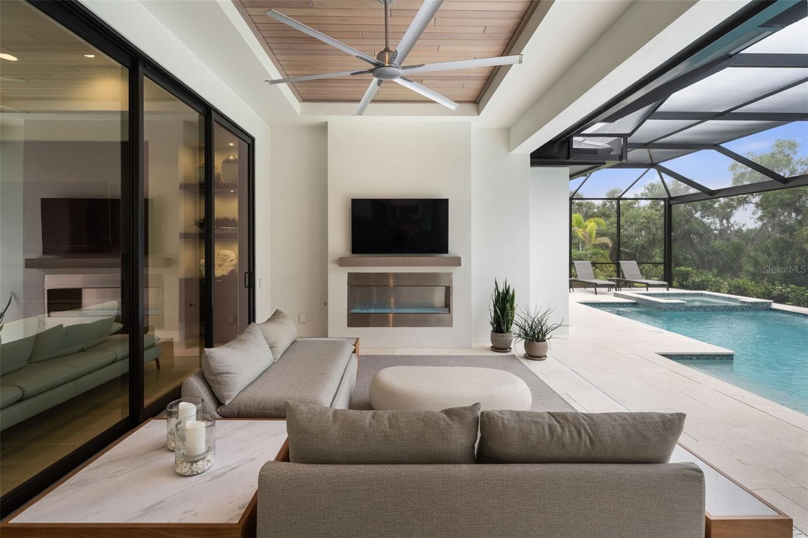 The outdoor TV is included. - 11721 RIVE ISLE RUN, PARRISH