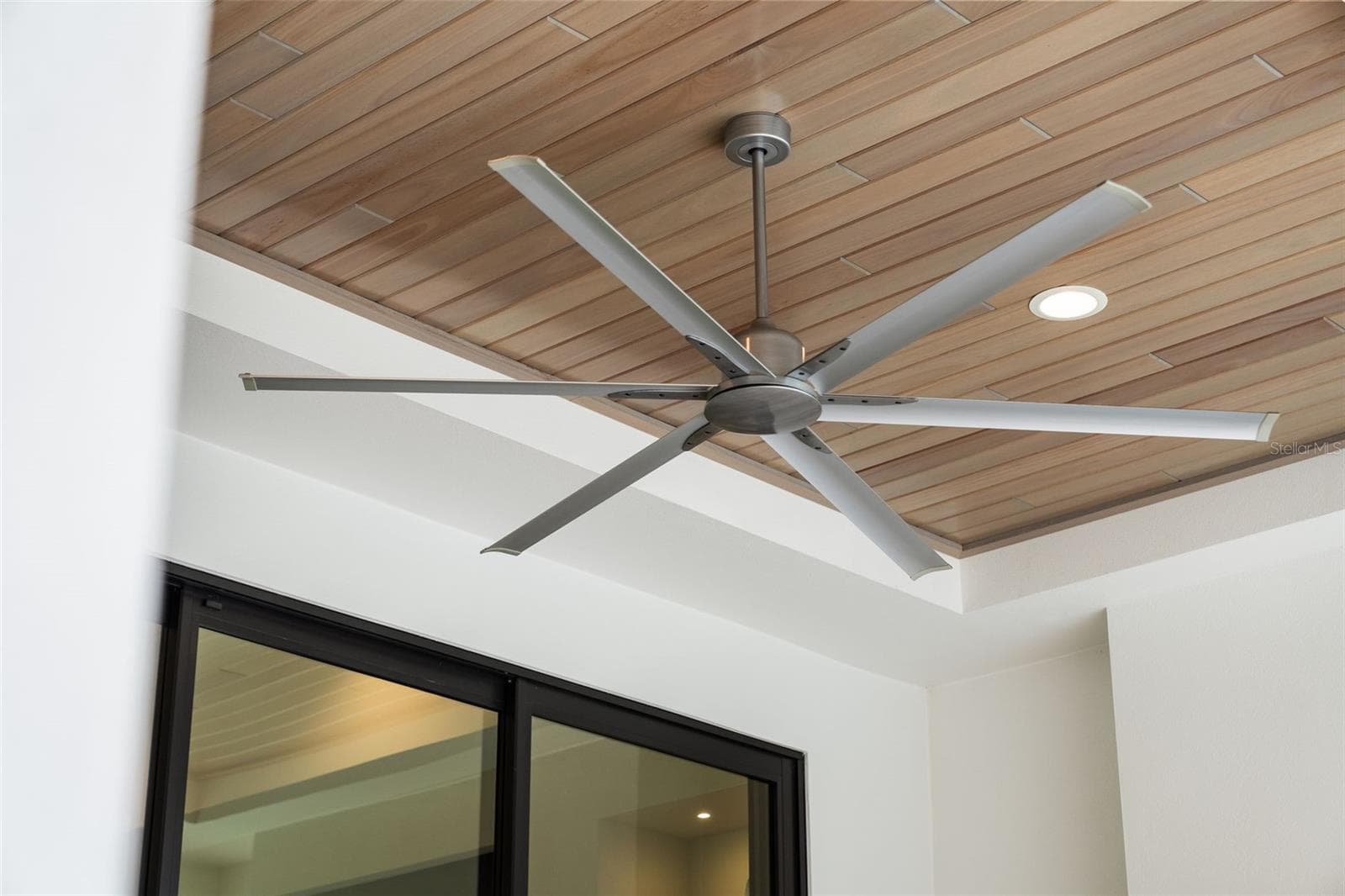 The covered lanai has wood ceilings, recessed lighting and oversized ceiling fans. - 11721 RIVE ISLE RUN, PARRISH