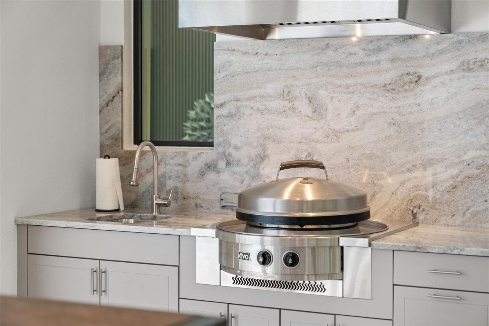 The Evo grill provides a variety of options for cooking delicious meals. - 11721 RIVE ISLE RUN, PARRISH