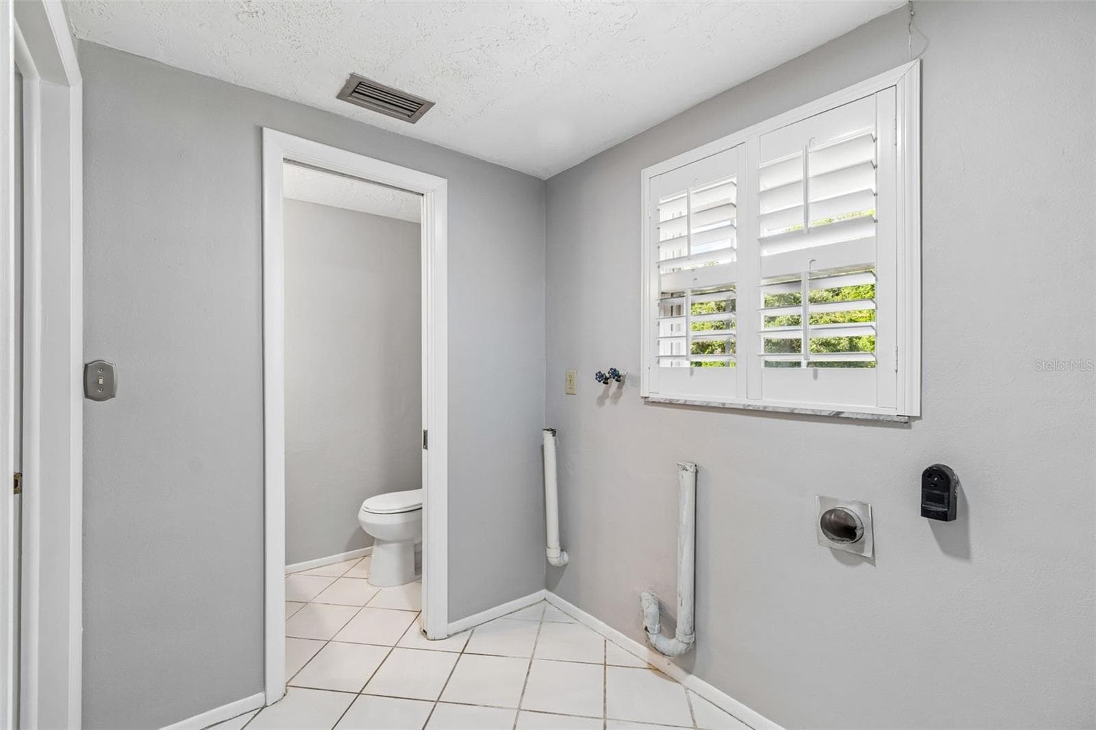 Inside laundry room - 7635 TANGLEWOOD DR, NEW PORT RICHEY