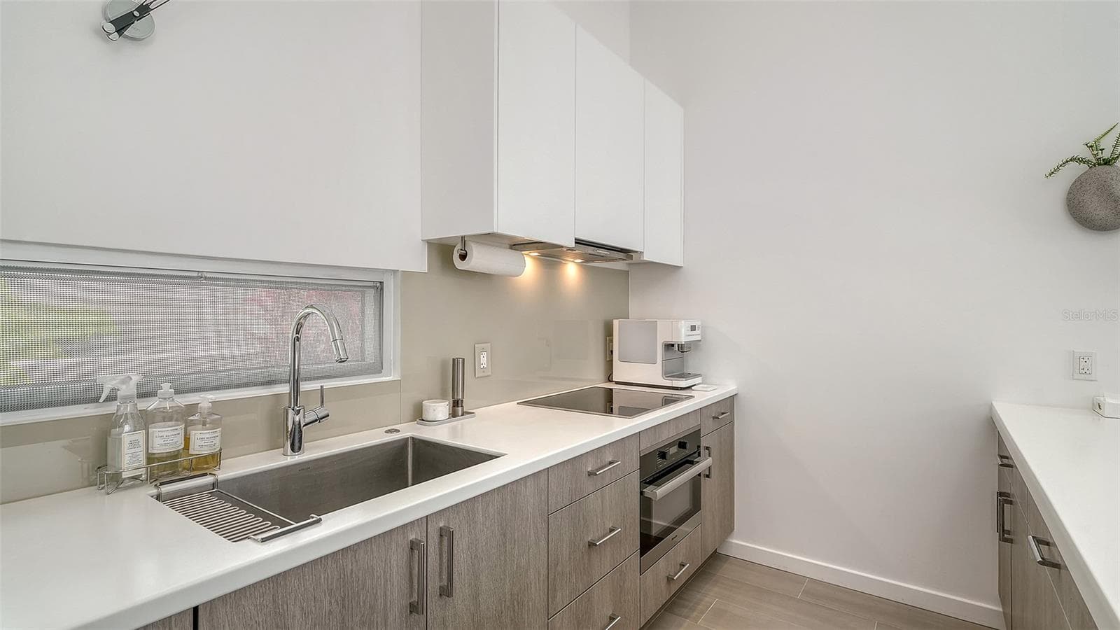 Roomy contemporary  bathroom with dual sinks and private toilet room. - 1350 5TH STREET #106, SARASOTA