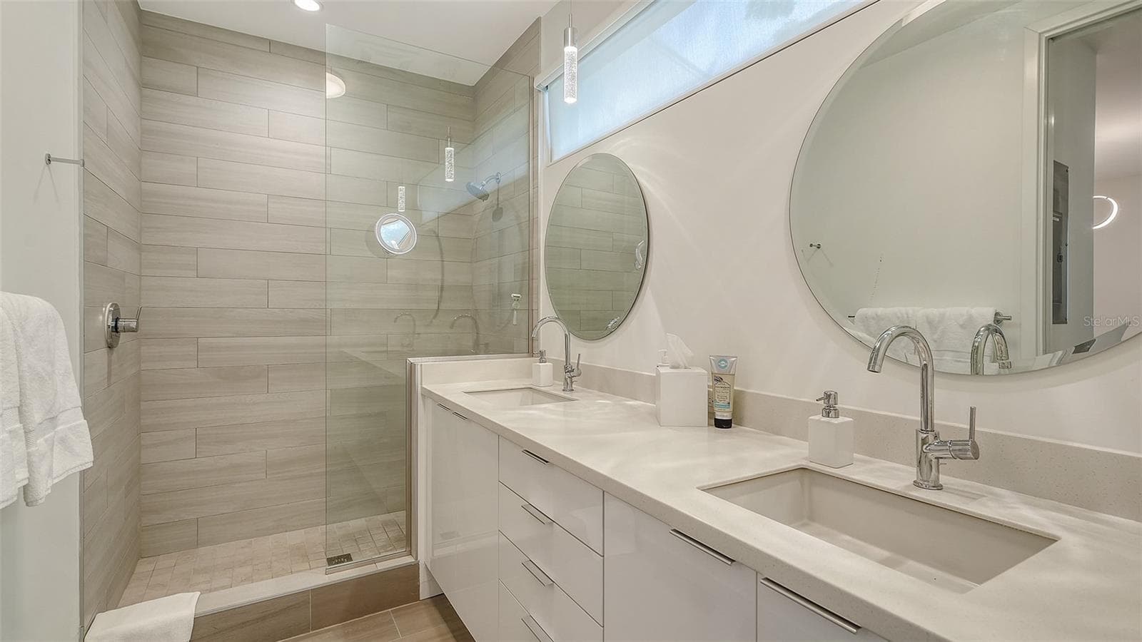 Roomy modern  bathroom with dual sinks and private toilet room. - 1350 5TH STREET #106, SARASOTA