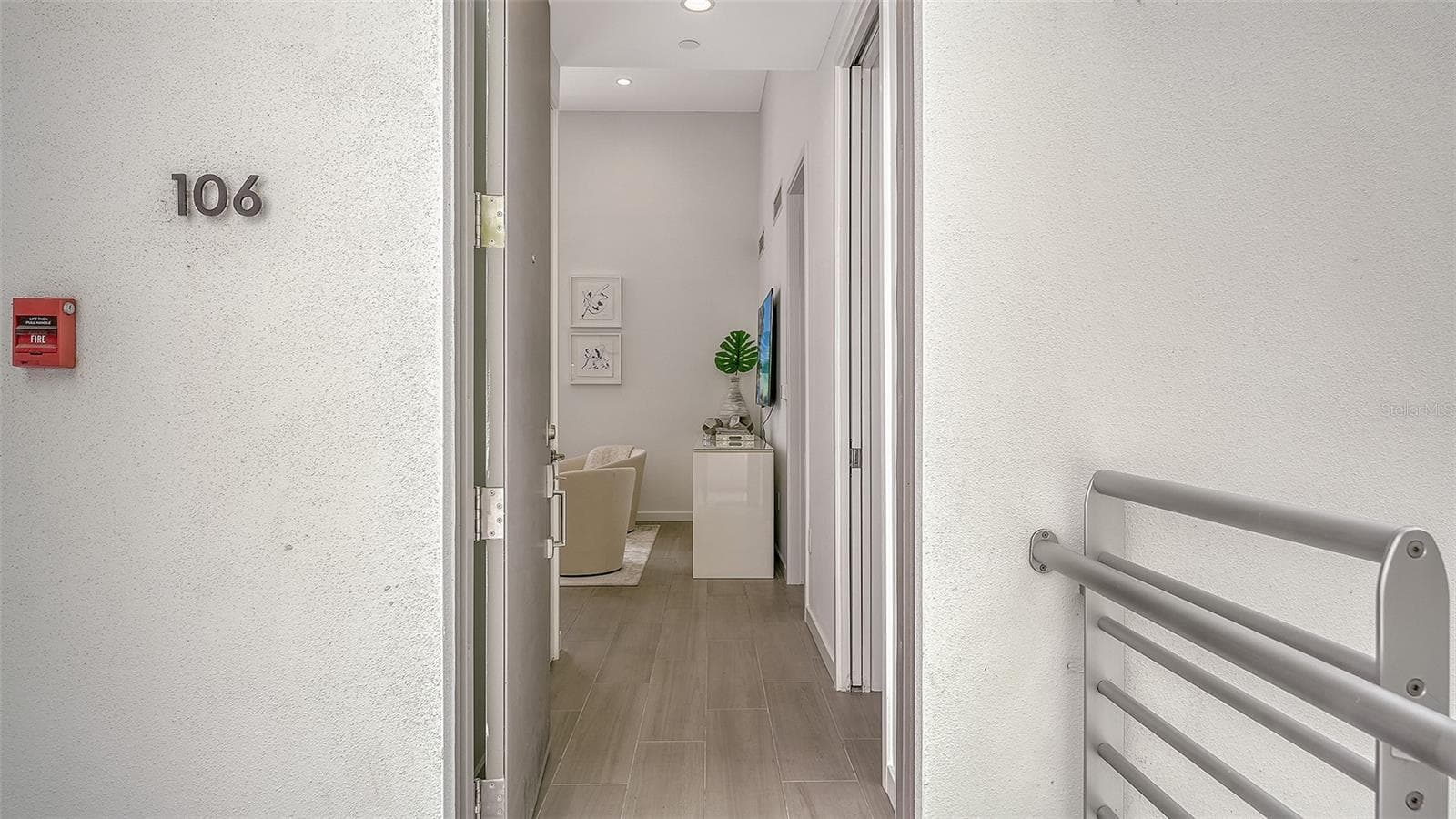 Entry door provides easy access to this end unit at Risdon on 5th. - 1350 5TH STREET #106, SARASOTA