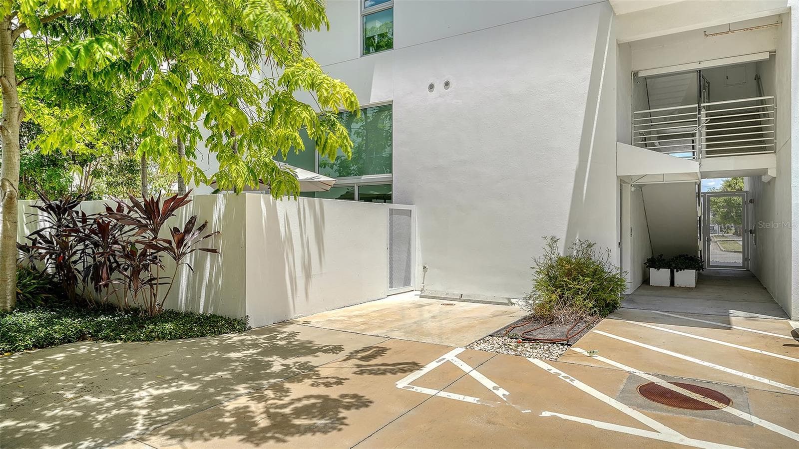 One designated owner parking space plus additional flex parking for owners and guests in courtyard with secure entry off 4th Way, south of the Risdon on 5th building in the RADD. - 1350 5TH STREET #106, SARASOTA