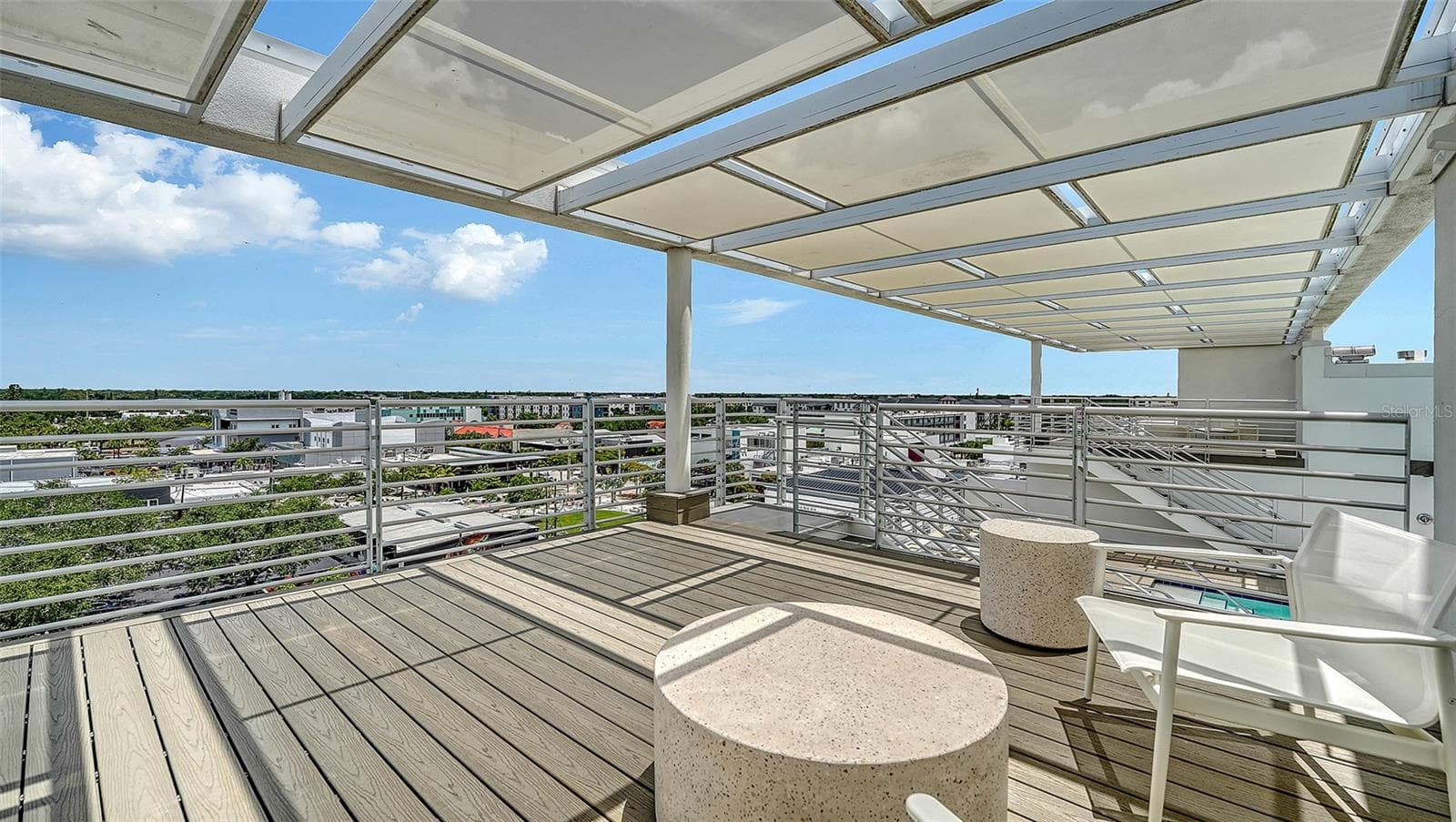 Two shaded rooftop lounge areas for relaxation and social gatherings. - 1350 5TH STREET #106, SARASOTA
