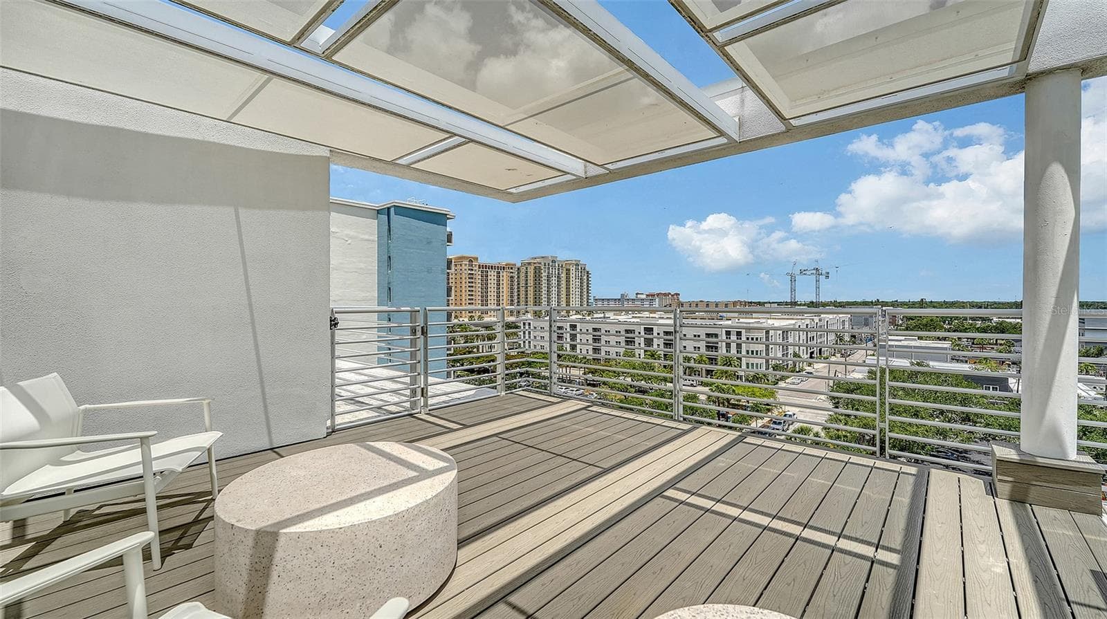 Two shaded rooftop lounge areas for relaxation and social gatherings - 1350 5TH STREET #106, SARASOTA