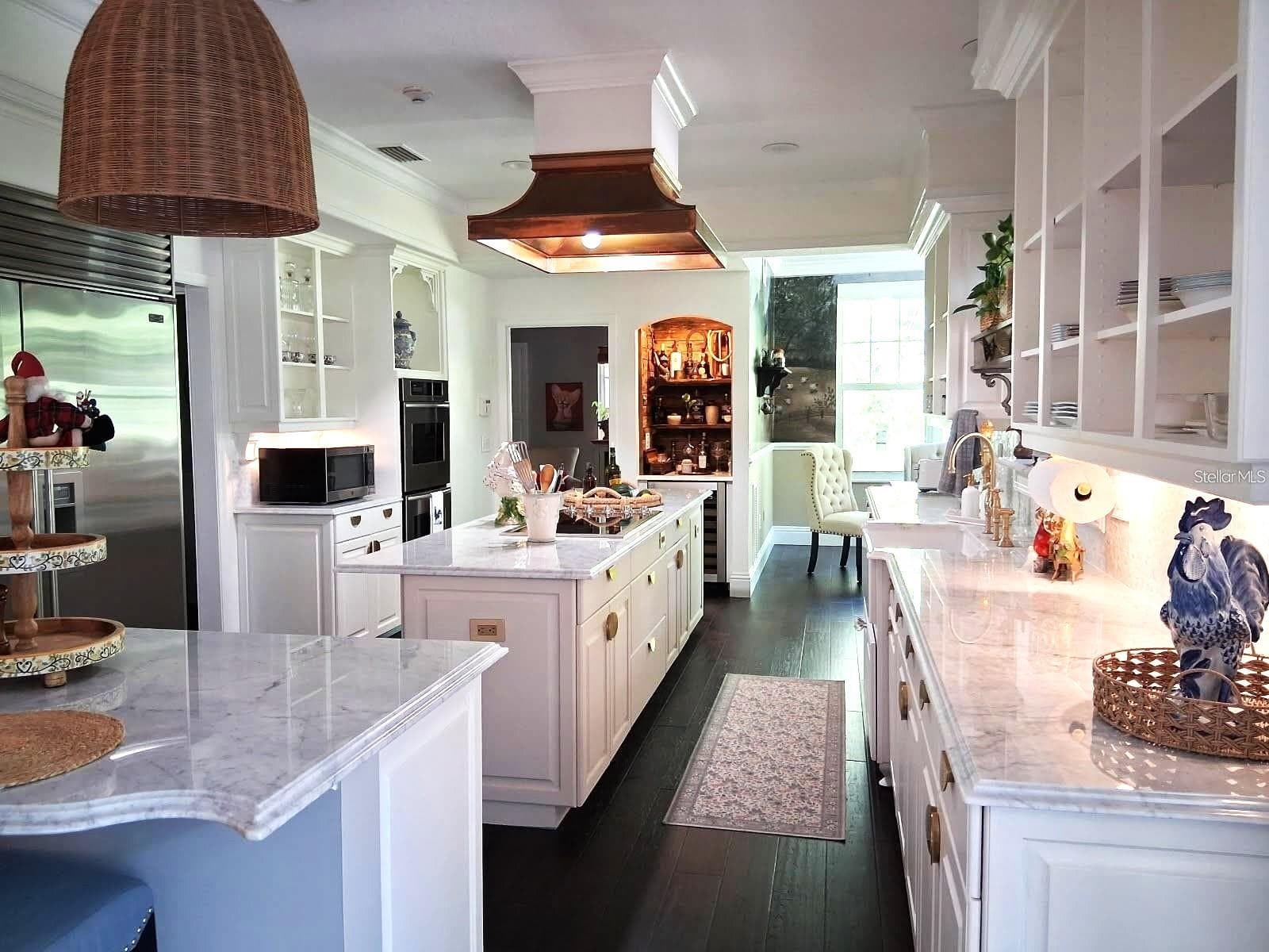 Complete Remodel. Marble Countertops. New Farmhouse Sink, All Hardware . Also Thermador Double Ovens, New Blue Star 36" Induction cooktop, Miele Dishwasher, Subzero Fridge and stunning Copper Range Hood - 3171 DICK WILSON DR, SARASOTA