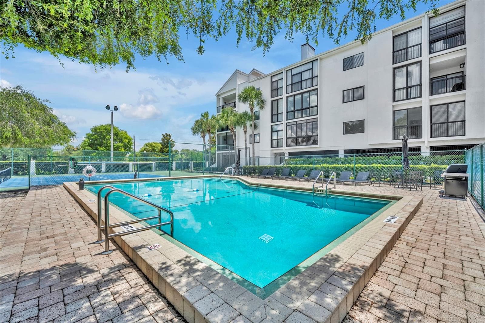 Just steps from the condo is Park West's beautiful pool. - 300 CAROLINA AVE #402C, WINTER PARK