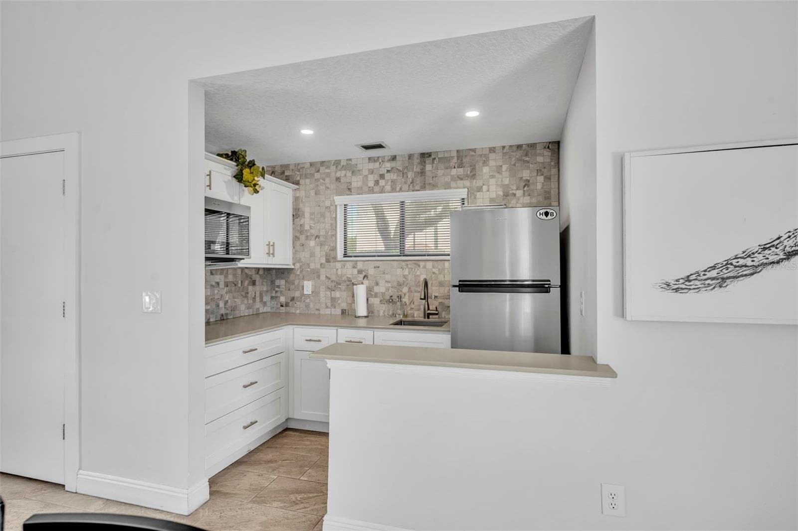 The community clubhouse also offers a kitchen for gatherings. - 300 CAROLINA AVE #402C, WINTER PARK