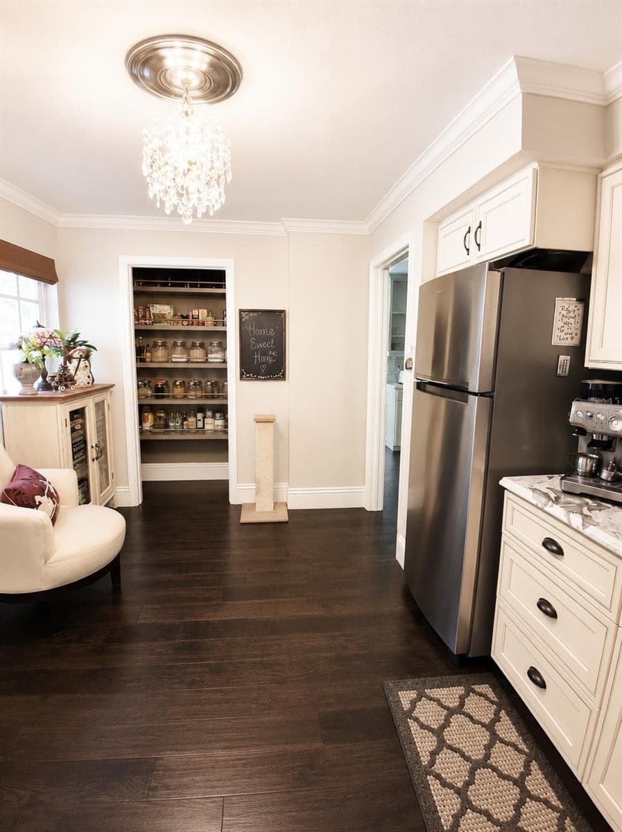2nd kitchen is Butlers pantry. Featuring New Fridge, Floors, Custom window treatment, New Chandleir with Window for Natural Light also a Laundry Room with Dog Shower! Countertops here are New Exotic Marble. Crown Molding in here as well - 3171 DICK WILSON DR, SARASOTA