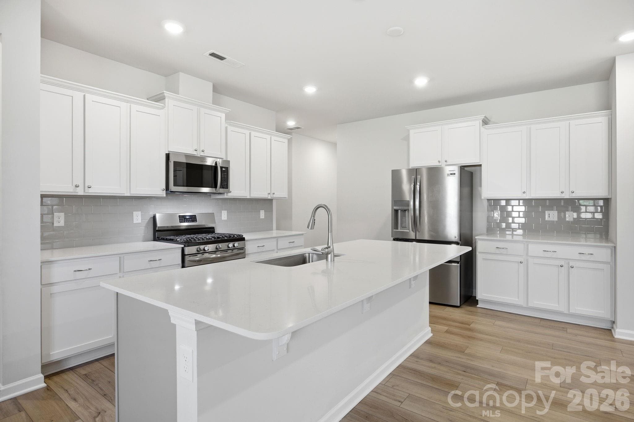 Chef's kitchen with a gas rnage - Statesville