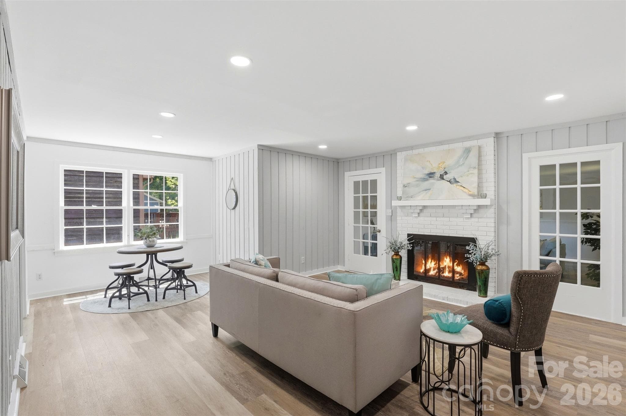 Living room fireplace centers the home and welcomes you to envision your holiday stockings hanging here! - 9624 Central Drive, Mint Hill