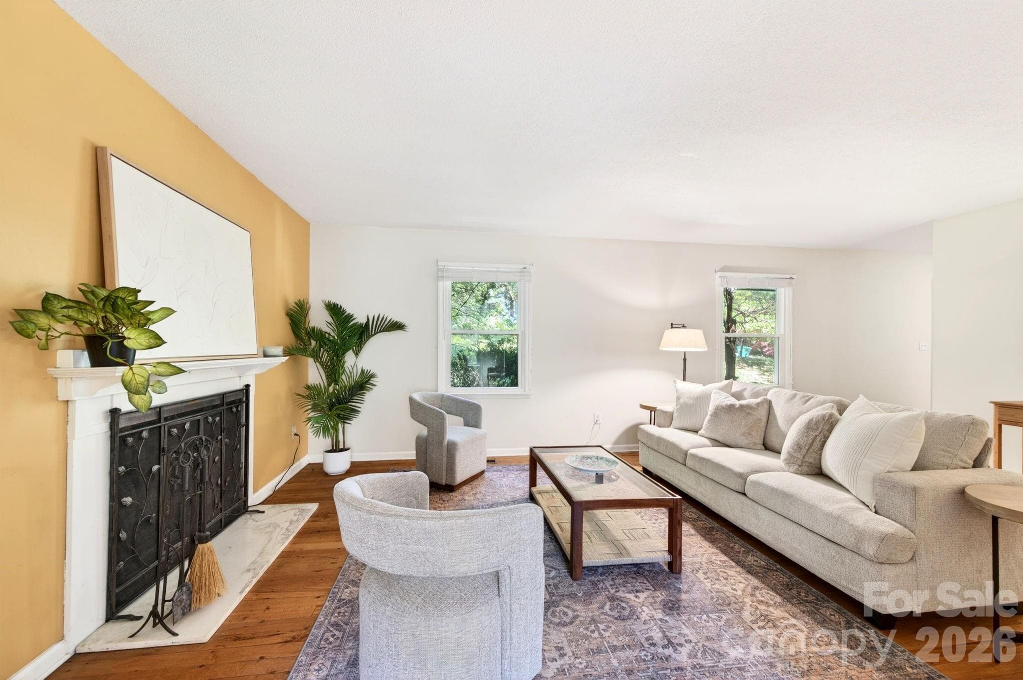 The spacious living room has a fireplace - Asheville