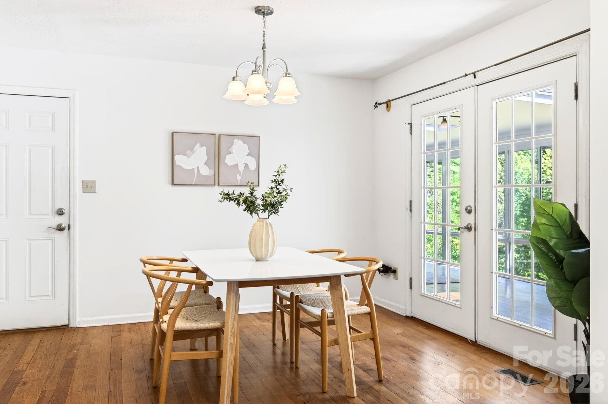 Freshly painted dining area with patio doors to the sunroom - Asheville