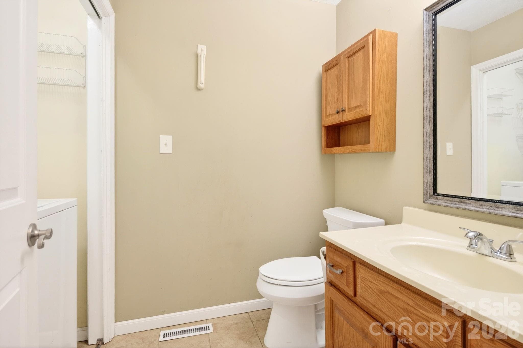 Main level half bathroom with laundry - 109 Lovers Loop Road, Asheville