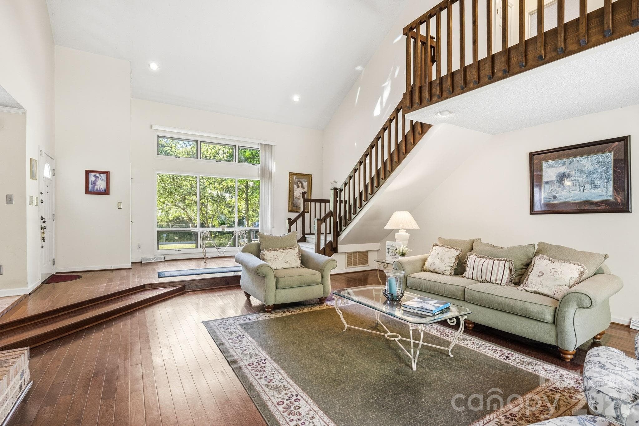 View of Great Room from the glass siding doors connecting to the deck in the backyard. - 1775 Apple Tree Lane, Fort Mill