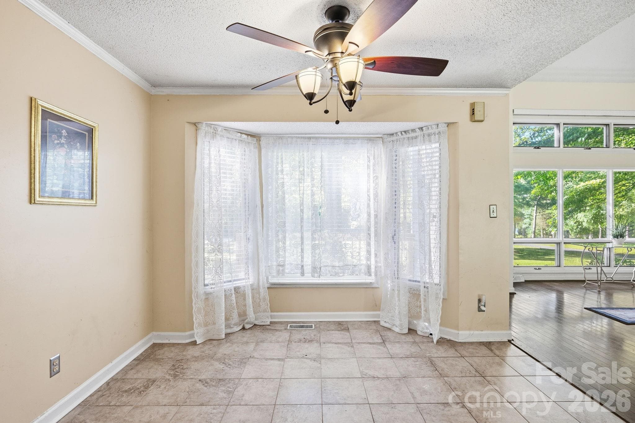 Dining Area with Bay Window overlooking front deck area and trees. - 1775 Apple Tree Lane, Fort Mill
